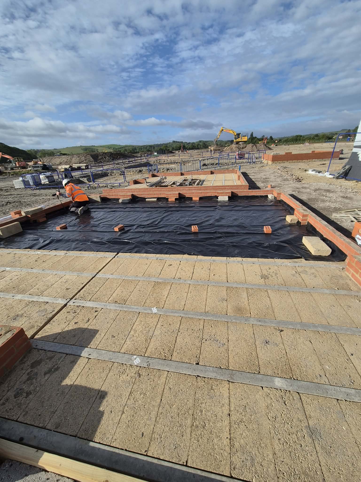 Fresh concrete foundation with blockwork and site preparation